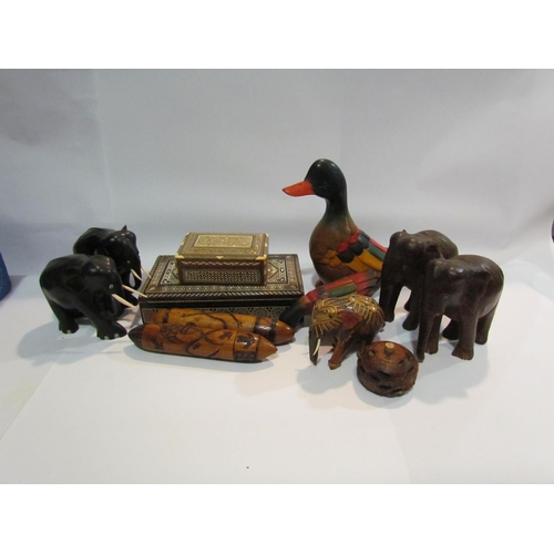 4499 - A mixed lot of hardwood and other elephants and mother-of-pearl inlaid marquetry boxes etc.