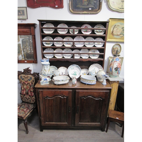 1005 - A 19th Century French walnut dresser with plate rack above two fielded panel door base, 220cm tall x... 