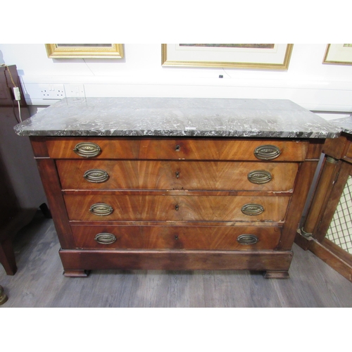 1012 - A 19th Century French flame mahogany commode with marble top, the four long drawers with embossed ov... 