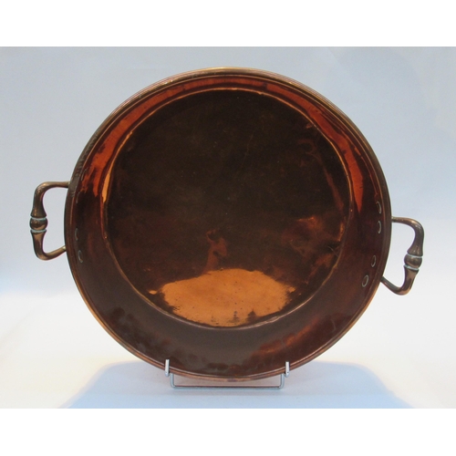 1019 - A copper twin handled circular pan, 40cm diameter