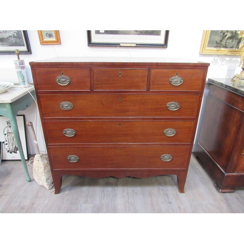 1026 - A Regency mahogany chest of three over three drawers with embossed oval plate handles, shaped apron,... 