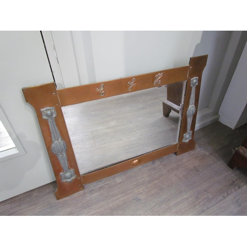 1088 - An Arts and Crafts copper wall mirror, the top rail with 'E.G.H.' lettering, the sides with inset pe... 