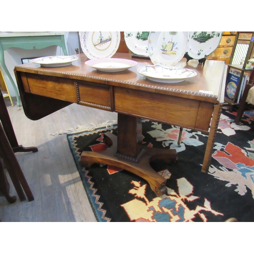 1107 - A late Regency / William IV mahogany drop-flap sofa table, 69.5cm x 92cm x 66.5cm   (R) £80