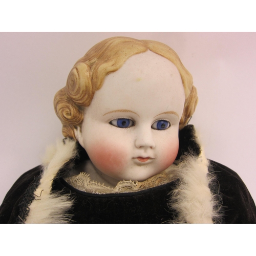 1109 - A mid 19th Century German Parian shoulder head doll with moulded blonde hair, striated  blue glass e... 