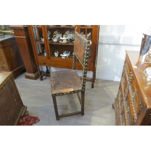 1150 - A late 17th/early 18th Century Spanish walnut chair with leather back and seat (repairs and distress... 