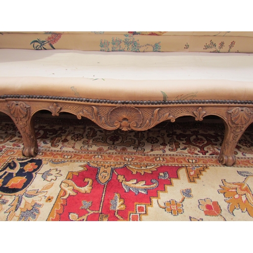 1154 - A Louis XV style hump-back sofa, carved scrolled foliate frame with scroll feet, bespoke floral and ... 