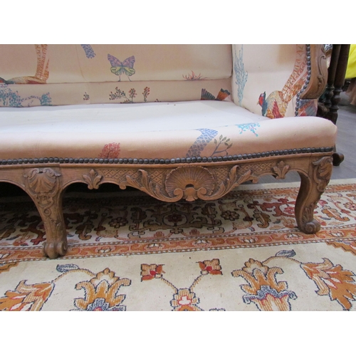 1154 - A Louis XV style hump-back sofa, carved scrolled foliate frame with scroll feet, bespoke floral and ... 