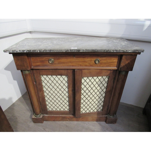 1134 - A late 19th Century marble top sideboard with single drawer above lattice panel doors, column detail... 