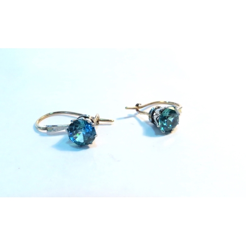 1257 - A pair of blue zircon pull through earrings  (C)