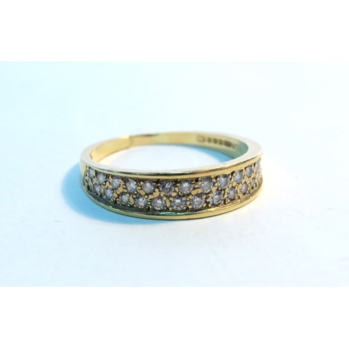 1267 - An 18ct gold two row diamond half hoop ring. Size R, split, 3.5g (C)