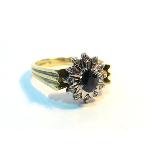 1271 - An 18ct gold sapphire and diamond cluster ring. Size N, 5.1g (C)