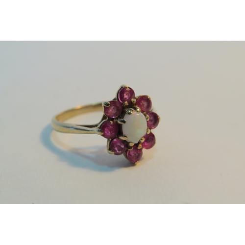 1275 - A 9ct gold ruby and opal cluster ring. Size K, 2.2g (C)