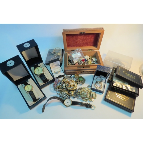 1281 - A quantity of costume jewellery including various brooches and wristwatches