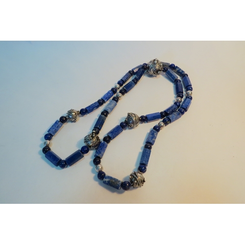 1282 - A Lapis Lazuli bead necklace with white metal bead spacers