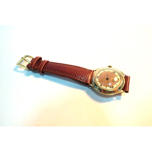 1285 - A 9ct gold cased gentlemans wristwatch with brown leather strap (C)