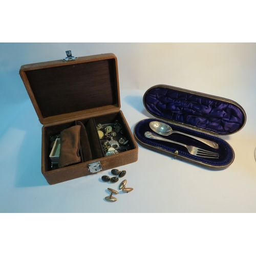 1324 - A box of mixed bijouterie including yellow metal cufflinks, together with a silver christening set