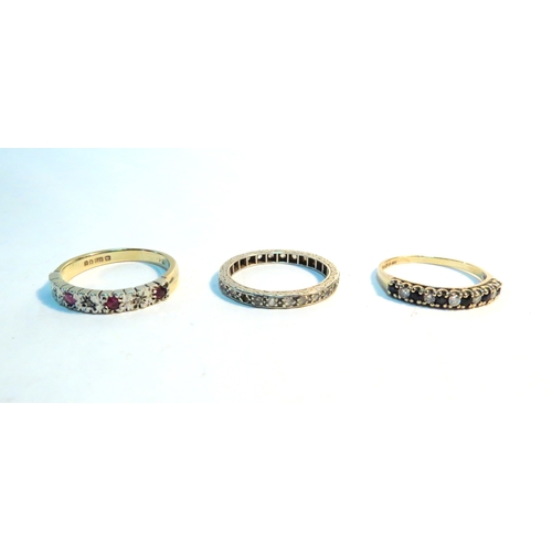 1325 - Three 9ct gold rings including sapphire and diamond half hoop, paste set eternity and ruby and diamo... 