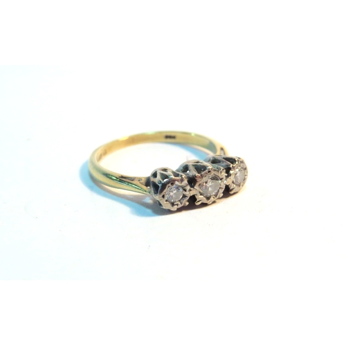 1330 - An 18ct gold three stone diamond ring. Size J, 2.6g   (C)