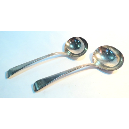 1337 - A pair of Georgian silver sauce ladles