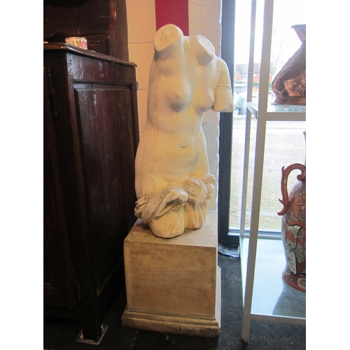 1003 - A modern Romanesque statue of nude torso, upon associated square display plinth base, the figure 110... 