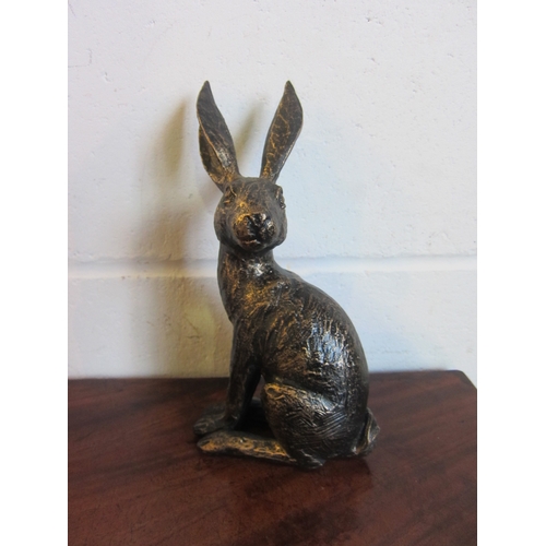 1014 - A bronze effect figure of a hare, 25.5cm tall