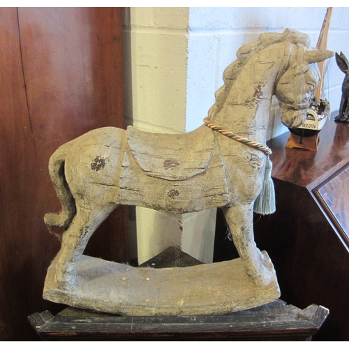 1017 - A rustic wood effect rocking horse, 56cm tall