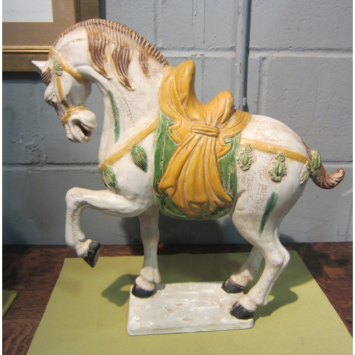 1041 - A ceramic tang style rearing horse figure, 46.5cm tall