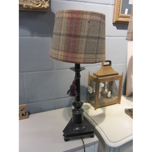 1084 - An ebonised and gilt enriched table lamp base with tartan shade