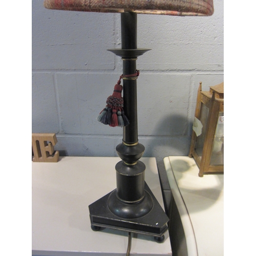 1084 - An ebonised and gilt enriched table lamp base with tartan shade