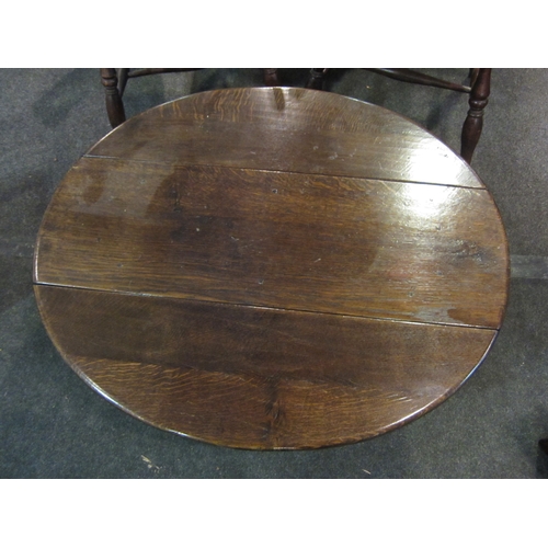 1102 - An oak gateleg coffee table, 95cm diameter