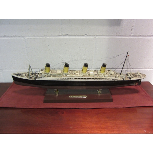 1122 - A model of RMS Titanic on stand, 77cm long