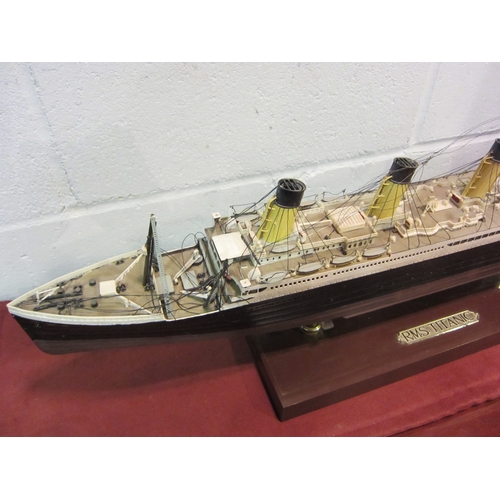 1122 - A model of RMS Titanic on stand, 77cm long