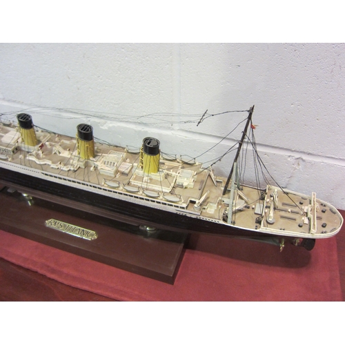 1122 - A model of RMS Titanic on stand, 77cm long