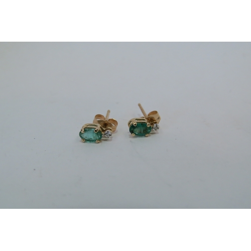 1304 - A pair of 9ct gold emerald and white stone set earrings