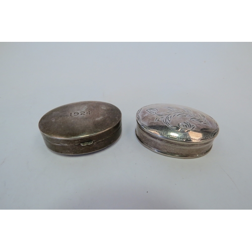 1179 - Two oval silver pill boxes, one engraved 1924 to lid, the other with floral design