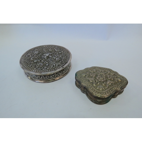 1358 - Two Eastern white metal trinket boxes, scrolled foliate relief to lids, the larger weighing 87g   (E... 