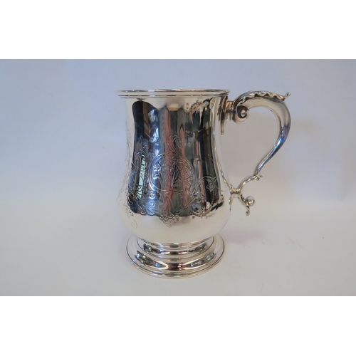 1361 - A Victorian silver pint tankard with engraved floral decoration, flared base, London 1857, Barnard a... 