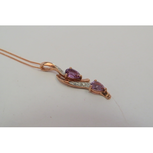 1383 - A 9ct rose gold amethyst and diamond set pendant on chain, 2g