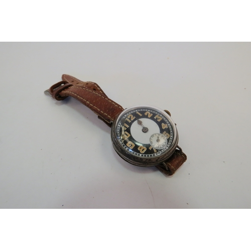 1418 - A silver cased black and white dial military style watch on leather strap, hand loose   (R) £25