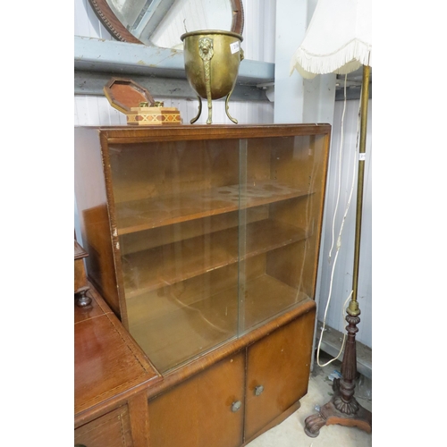 2105 - A mid 20th Century oak and glazed bookcase with cupboard base       (E) £5-10