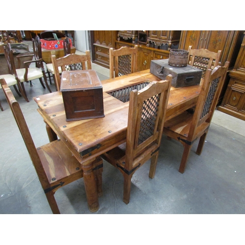 2178 - A mango wood dining table and six chairs with iron grill panels 90 x 180cm