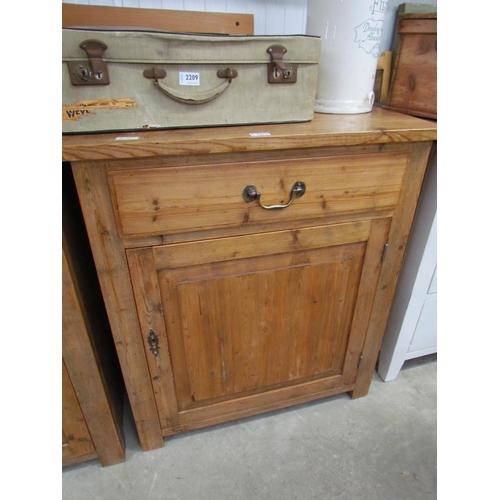 2207 - A rustic pine cupboard, the single drawer over single door