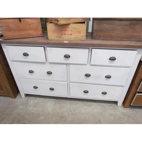 2218 - A white painted low chest of three short over two rows of two long drawers, natural top 154cm wide