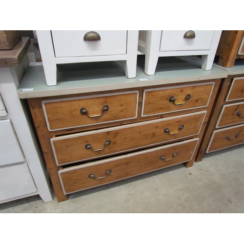 2220 - A rustic pine chest of two short over two long drawers, grey painted top, brass swan neck handles