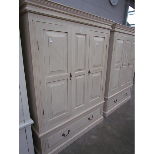 2236 - A white painted wardrobe, two doors over single drawer, plinth base