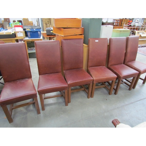 2253 - A set of six brown leather high-back dining chairs on oak square supports