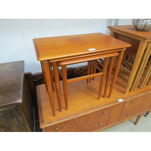 2309 - A 1970's teak nest of three tables