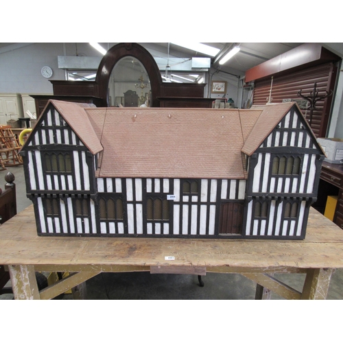 2004 - A Tudor style model house with lift top center roof