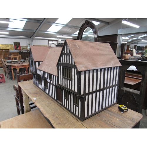 2004 - A Tudor style model house with lift top center roof