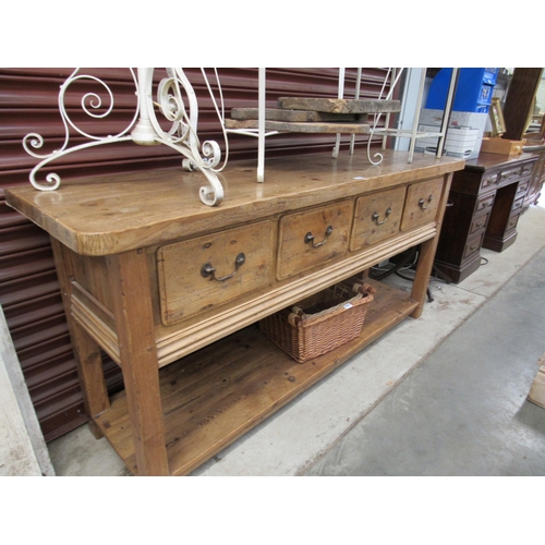 2040 - A rustic pine buffet sideboard, four deep drawers, brass swan neck handles, with pot board undertier... 